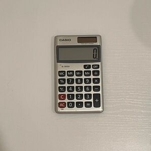 Casio Silver Calculator with Black and Red Buttons